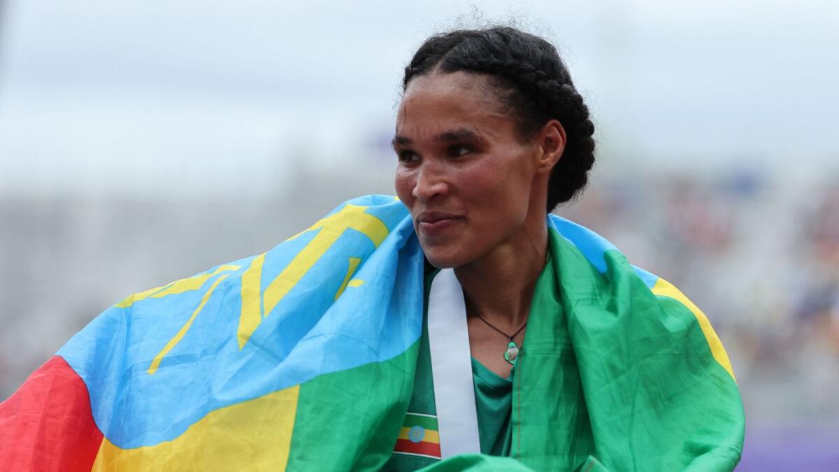 Ethiopia's Letesenbet Gidey celebrates after winning the women's 10,000 metres final. — Reuters