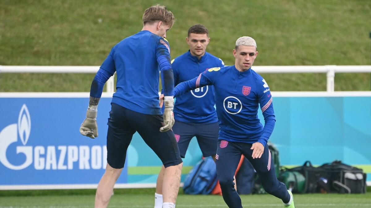 England's midfielder Phil Foden (right), defender Kieran Trippier (centre) and goalkeeper Jordan Pickford (left) during a training session. (AFP)