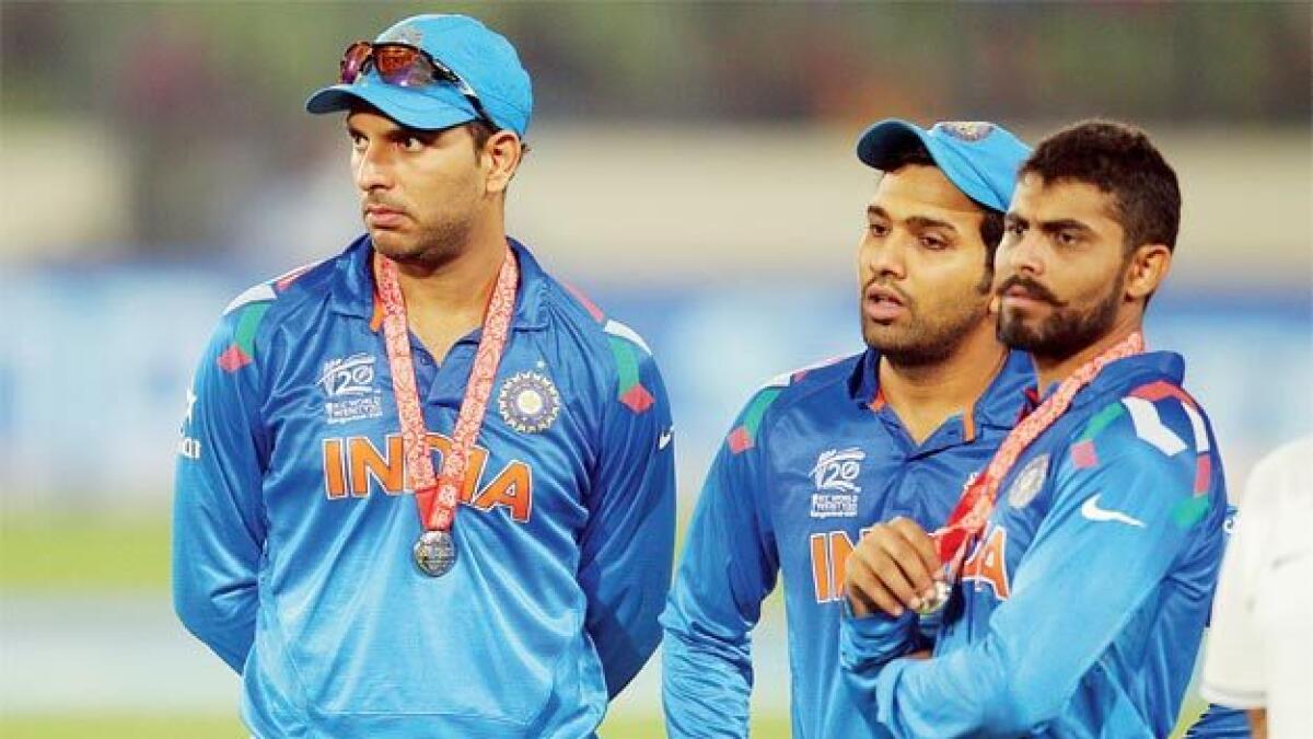 Yuvraj Singh (left) and Rohit Sharma (centre) in this 2014 photo. - Getty Images file