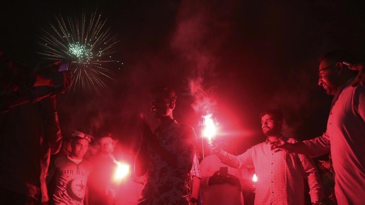 People light up fireworks during the Independence Day celebrations, in Karachi, Pakistan. Millions of Pakistanis celebrate the 74th Independence Day from British rule. AP Photo