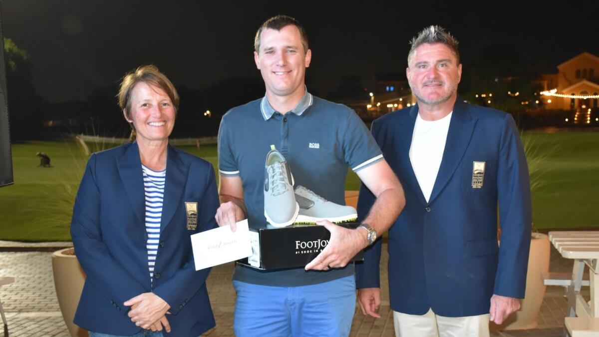 lack Tee Challenge winner Jim Prescott, flanked by Arabian Ranches Club Captains Nicola Breeze and Mark Gathecole. - Supplied photo