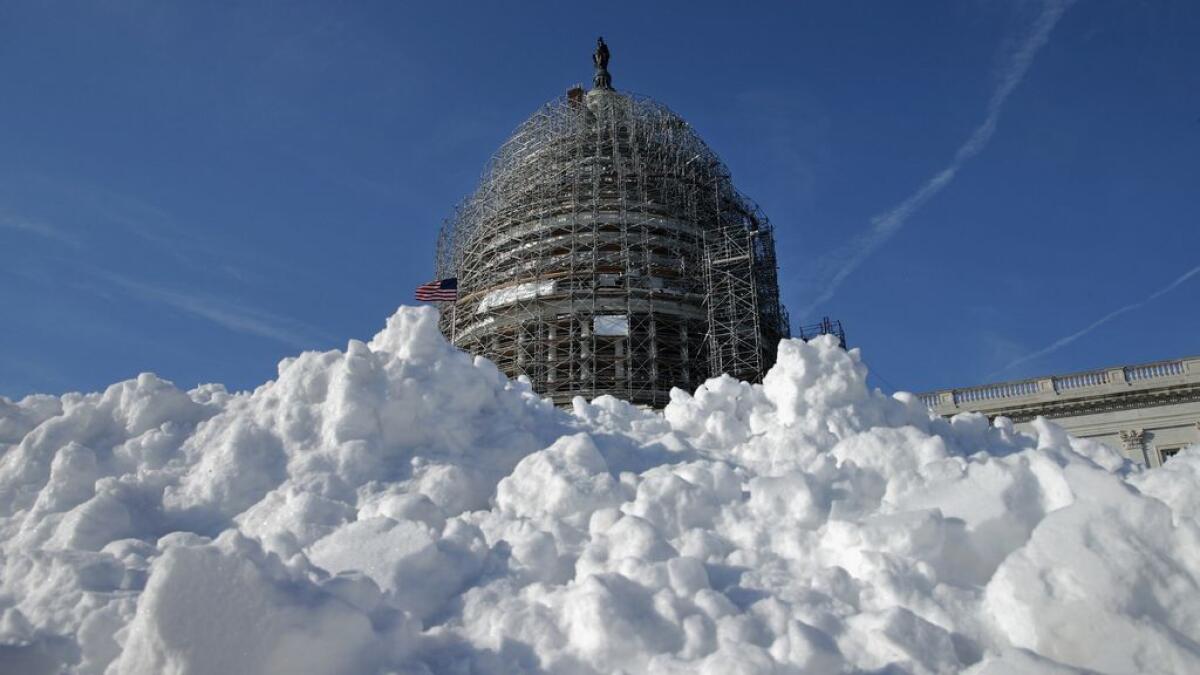 A pile of shoveled snow stands in the plaza on the east side of the US Capitol in Washington, DC.-AFP