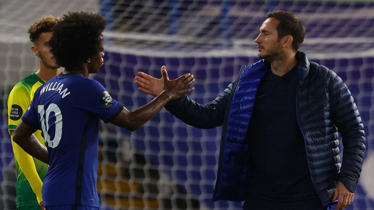 Chelsea's coach Frank Lampard (right) said he is unsure if Willian will remain at the club next season. -- AFP file