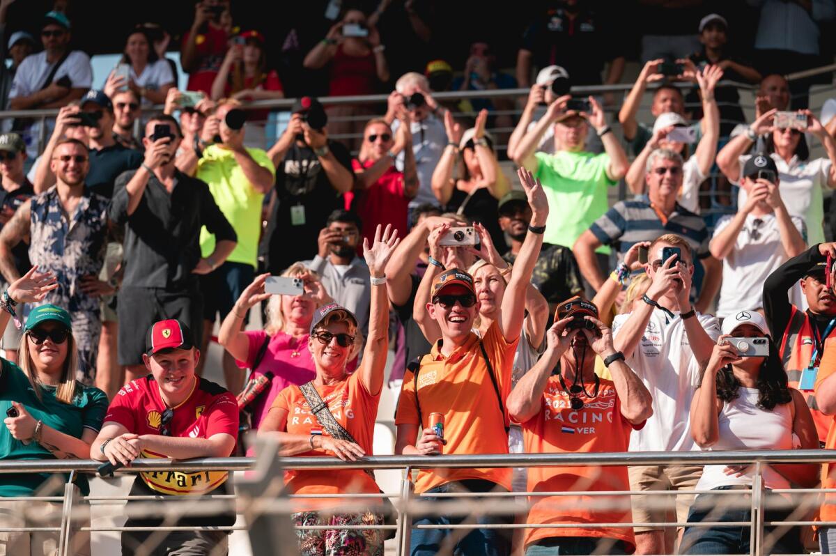 Dutch fans cheer for Max Verstappen at the Yas Marina Circuit. — Photo by Neeraj Murali