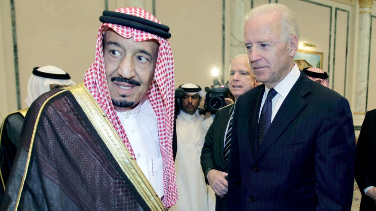 King Salman with Joe Biden in 2011, while Biden was the US Vice-President. — AP file