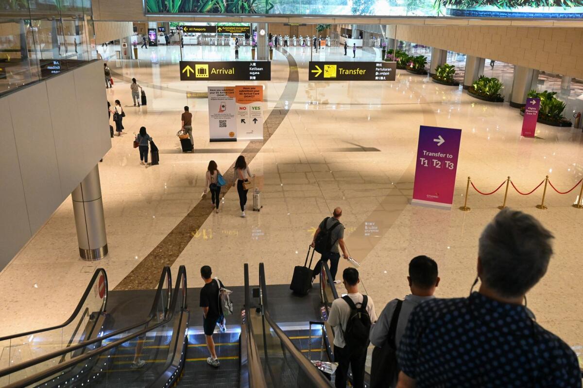 Passengers head towards an immigration checkpoint at the reopened Singapore Changi Airport Terminal 4 in Singapore. Photo: AFP