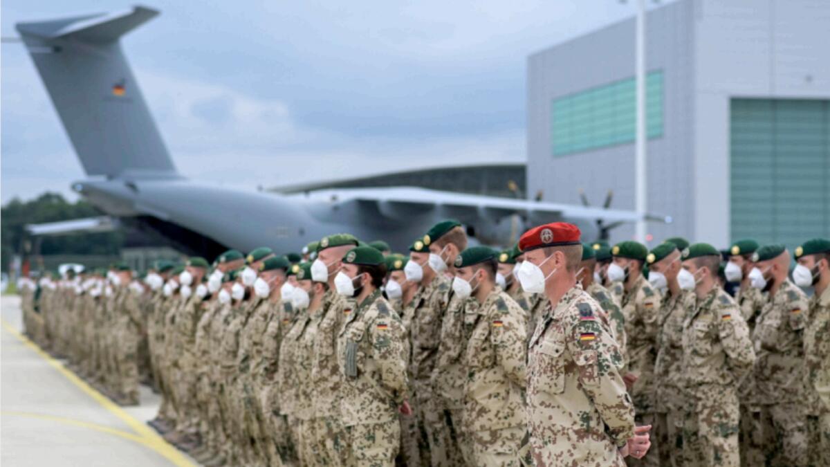 German soldiers line up for the final roll call in front of an German armed forces Bundeswehr Airbus A400M cargo plane after returning from Afghanistan. — Reuters file