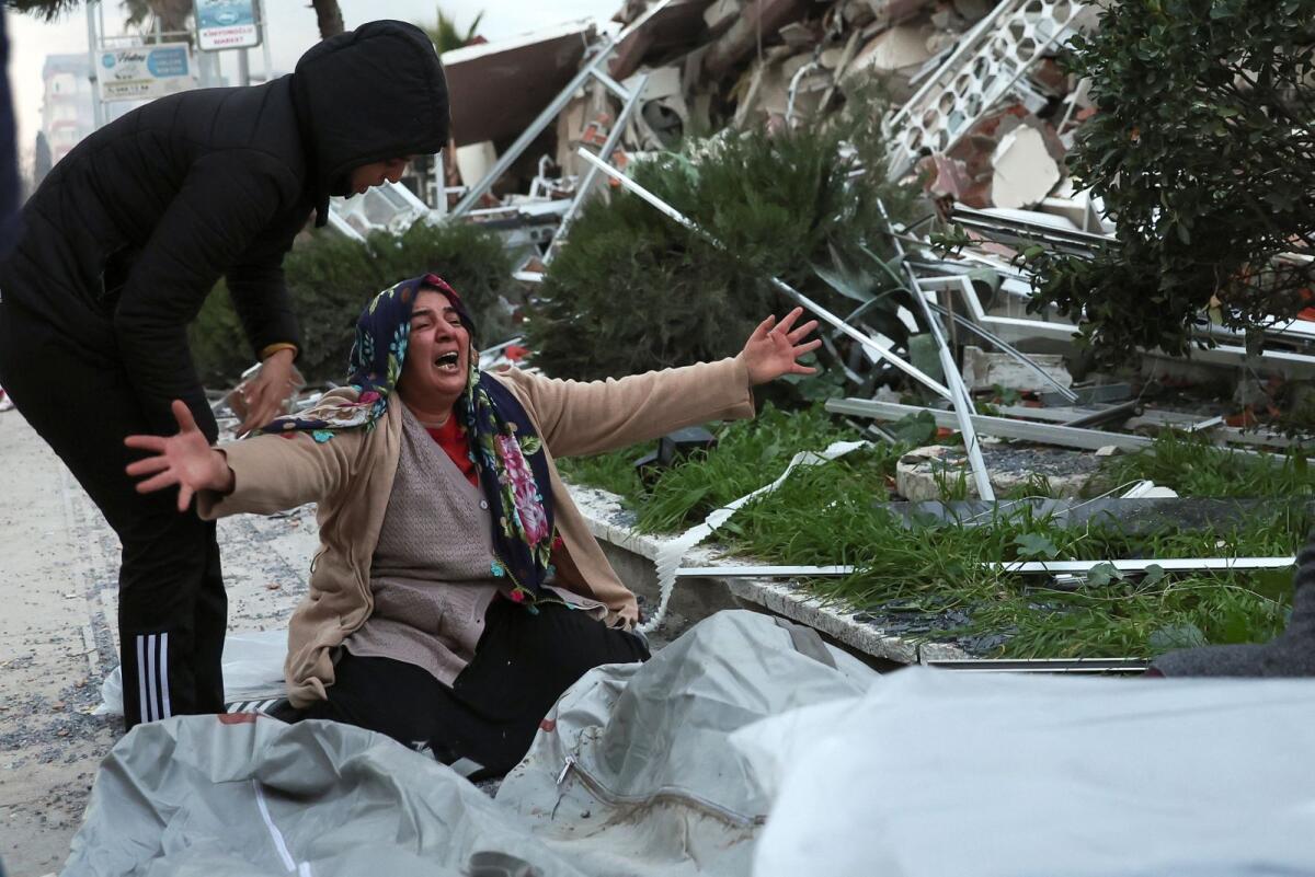 A woman mourns for her deceased relative, following an earthquake in Hatay Province, Turkey, February 7, 2023. Photo: Reuters
