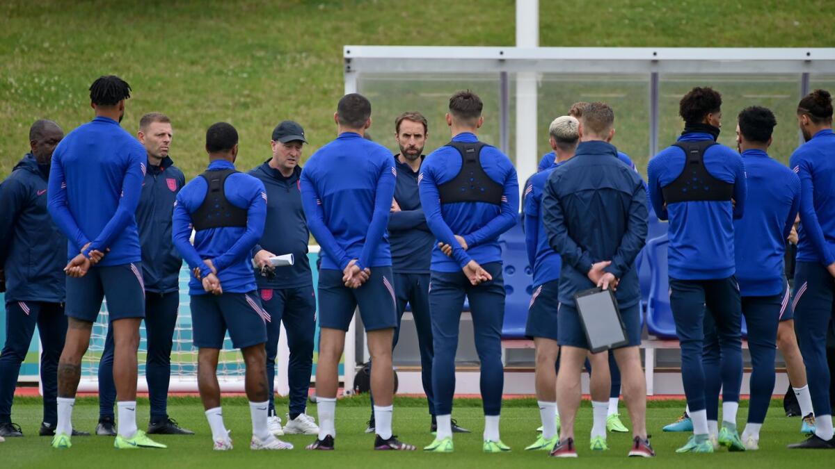 England's manager Gareth Southgate (centre) speaks to his players during a training session at St George's Park, Burton upon Trent, England. — AP
