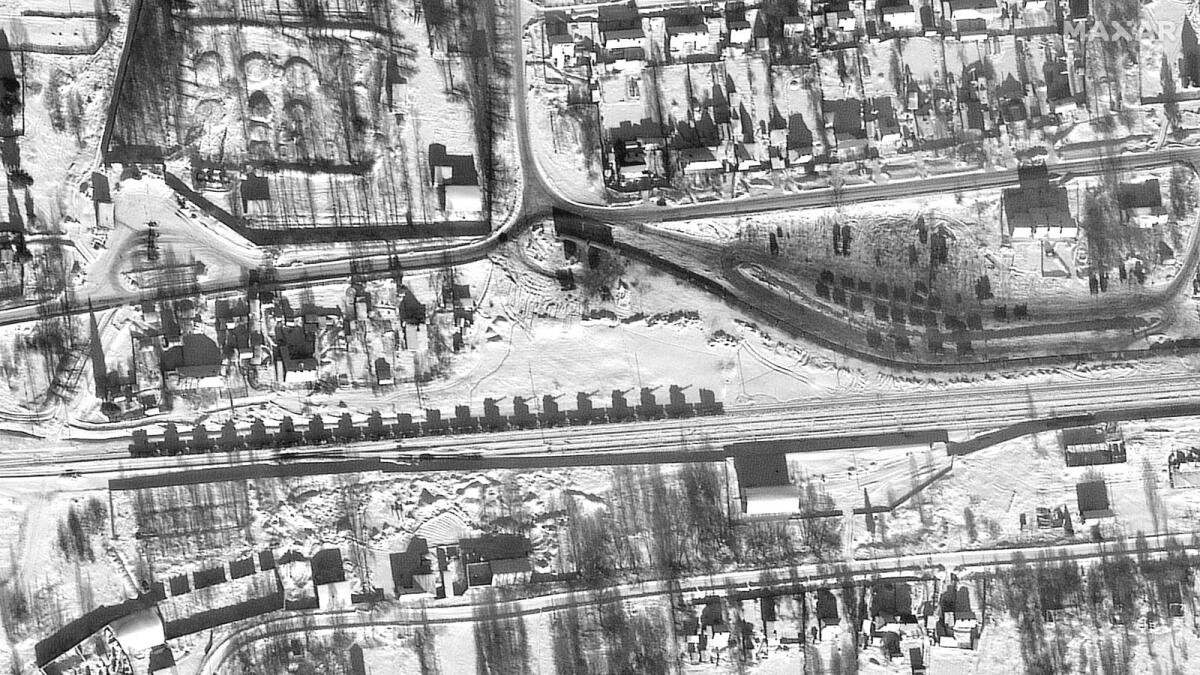 This satellite image released by Maxar Technologies shows armor and self-propelled  artillery loaded on flatcars and railyard in Yelnya, Russia on February 13, 2022. (Photo: AFP)