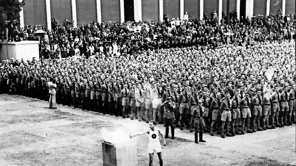 BLAST FROM THE PAST: The lighting of the Olympic flame in Lustgarten at the 1936 Berlin Games. The next two editions of the Summer Games in 1940 and 1944 had to be cancelled because of World War II. - AP file