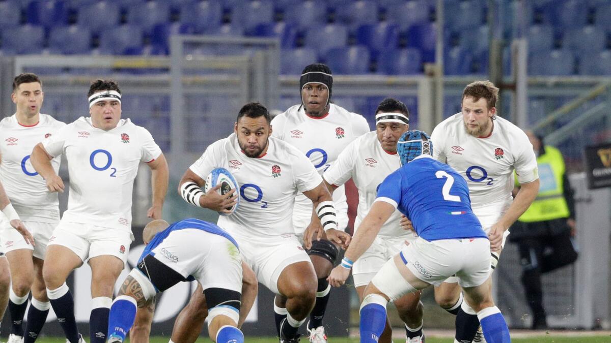 England's Billy Vunipola runs with the bad towards the Italian defence during the Six Nations rugby union international match between Italy and England at the Olympic Stadium in Rome.— AP