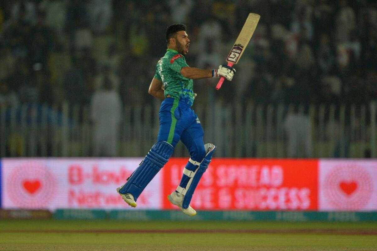 Multan Sultans' Usman Khan celebrates after scoring a century on Saturday. — AFP