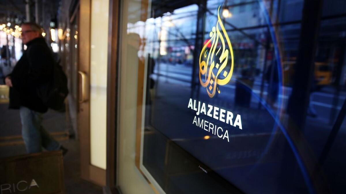 The logo for Al Jazeera America is displayed outside of the cable news channels offices in New York City.