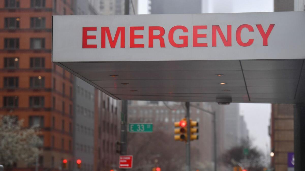 A sign is seen at the NYU Langone Health Center hospital emergency room entrance in New York City.