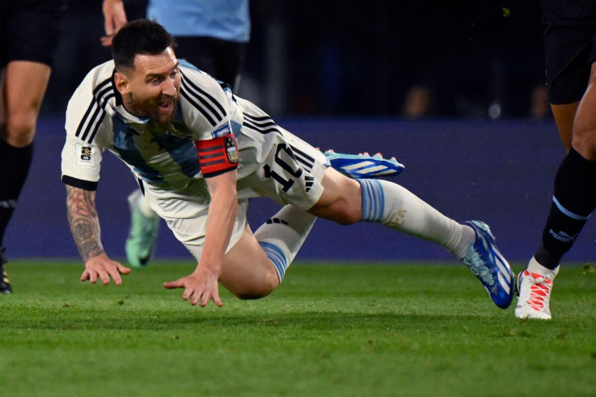 Argentina forward Lionel Messi reacts after being fouled during the match against Uruguay. — AFP