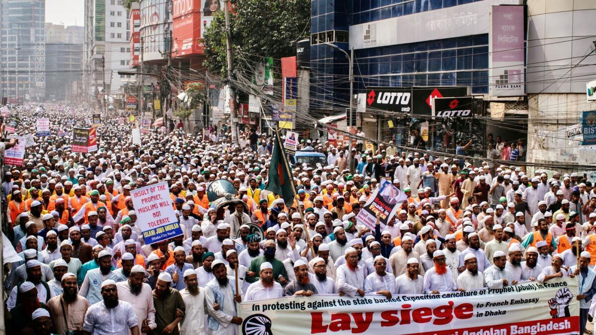 Supporters and activists of the Islami Andolan Bangladesh, an Islamic political party, take part in a protest calling for the boycott of French products and to denounce the French President Emmanuel Macron for his comments over a cartoon of Prophet Muhammad, in Dhaka, Bangladesh, October 27, 2020.