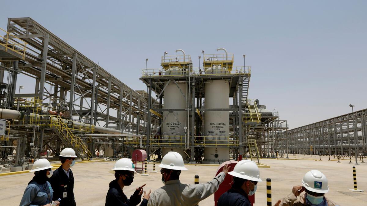 Saudi Aramco engineers and journalists look at the Hawiyah Natural Gas Liquids Recovery Plant in Hawiyah, in the Eastern Province of Saudi Arabia. — AP file photo