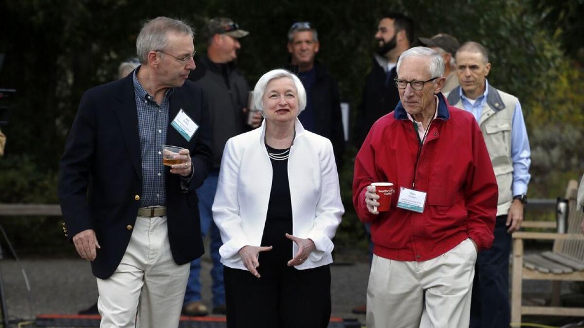  Janet Yellen, Stanley Fischer, vice-chairman of the Board of Governors of the Federal Reserve System, and Bill Dudley, president of the Federal Reserve Bank of New York, before Yellen’s speech to the annual invitation-only conference of central bankers f