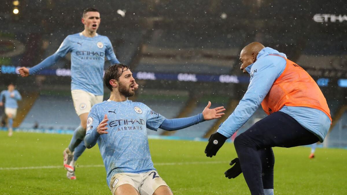 Manchester City's players celebrate a goal against Aston Villa during the English Premier League match. — AFP