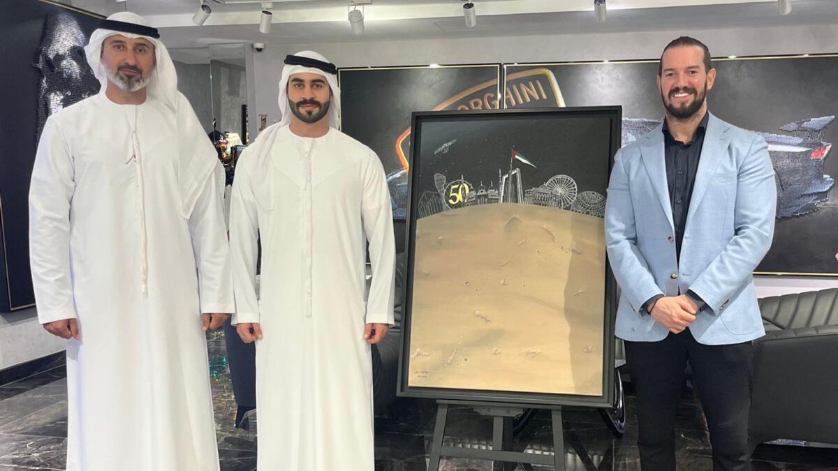 Sheikh Humaid Bin Khalid Al Qasimi (centre) with Mohamed Al Banna (left) and Ryan Howells. - Supplied photo