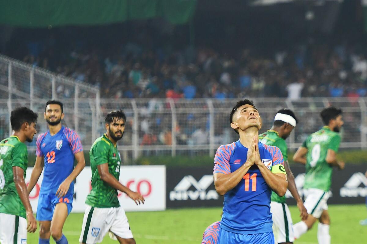 Indian captain Sunil Chhetri (right) reacts after missing a goal during the World Cup qualifying match against Bangladesh. (AFP file)
