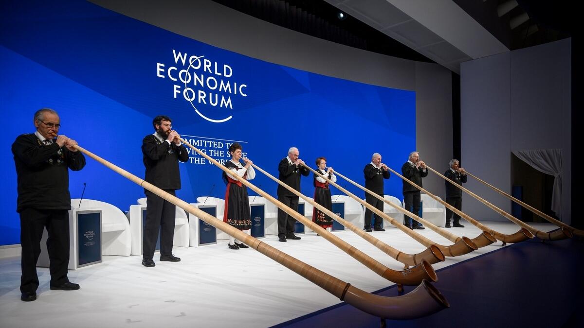 Alphorn blowers perform during the opening of the World Economic Forum (WEF) annual meeting, on January 22, 2019 in Davos, eastern Switzerland.  AFP
