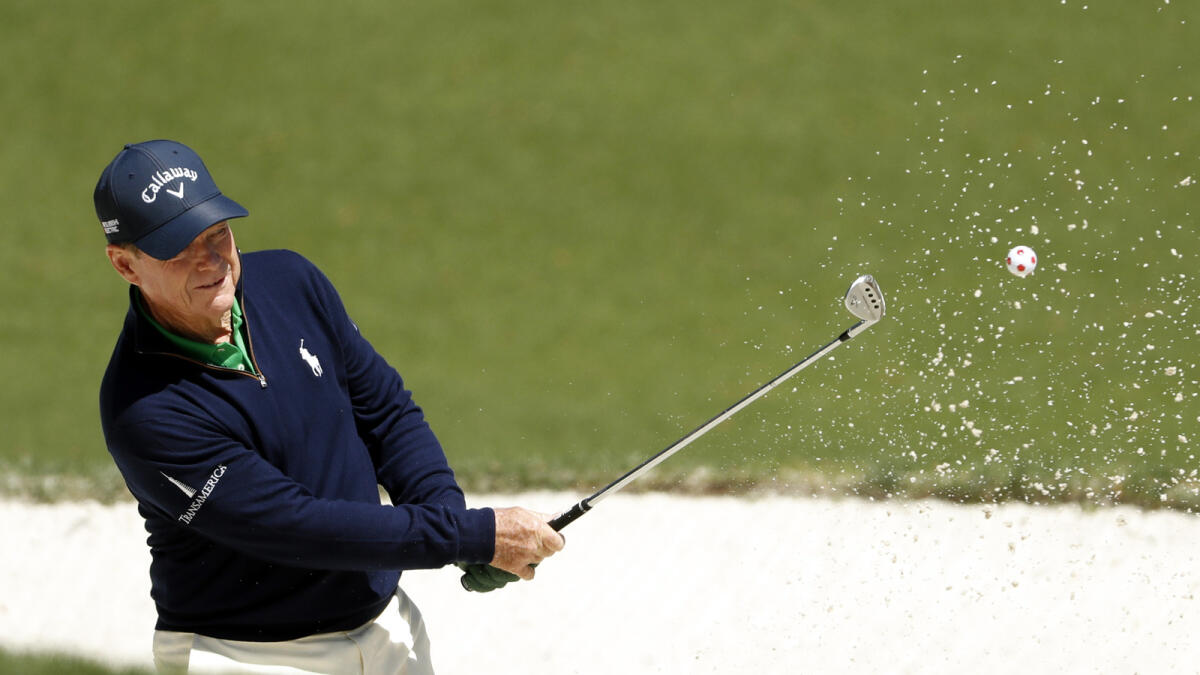 Tom Watson hits out of a bunker during the first round of the 2016 The Masters golf tournament.  