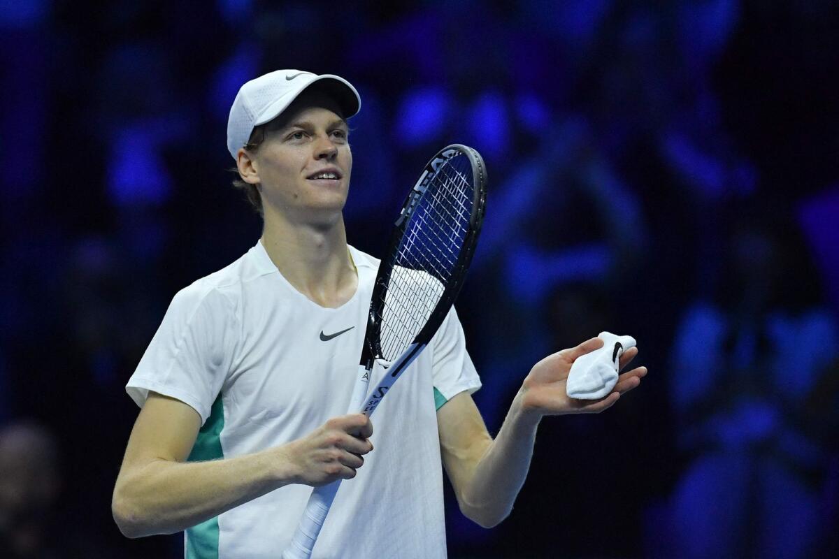 Italy's Jannik Sinner celebrates after winning 6-4, 6-4  against Greece's Stefanos Tsitsipas during their first round-robin match at the ATP Finals tennis tournament in Turin. - AFP