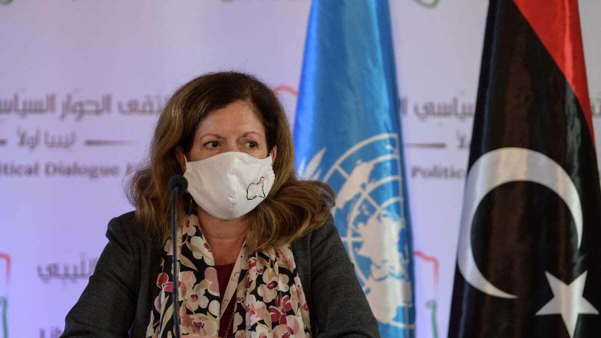 UN acting envoy to Libya Stephanie Williams wears a protective mask before giving a Press conference in the Tunisian capital Tunis following talks on the Libyan conflict.