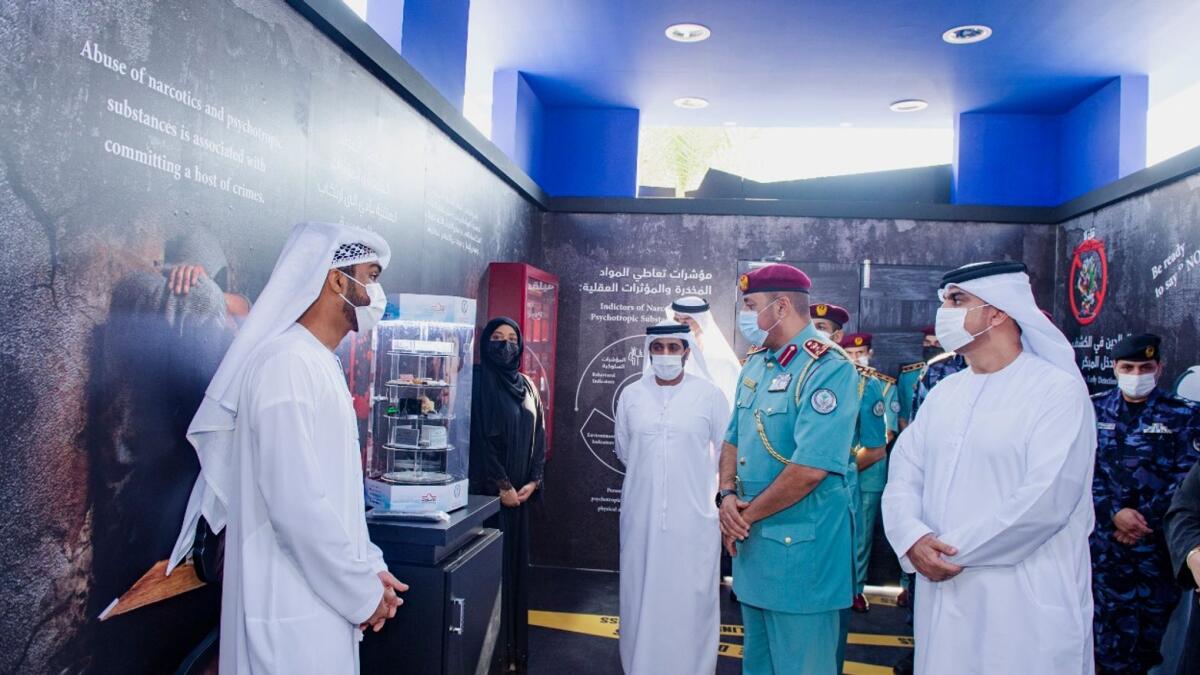 Sharjah Police officers visit the pavilion of their anti-drug campaign in Khor Fakkan. — Supplied photo