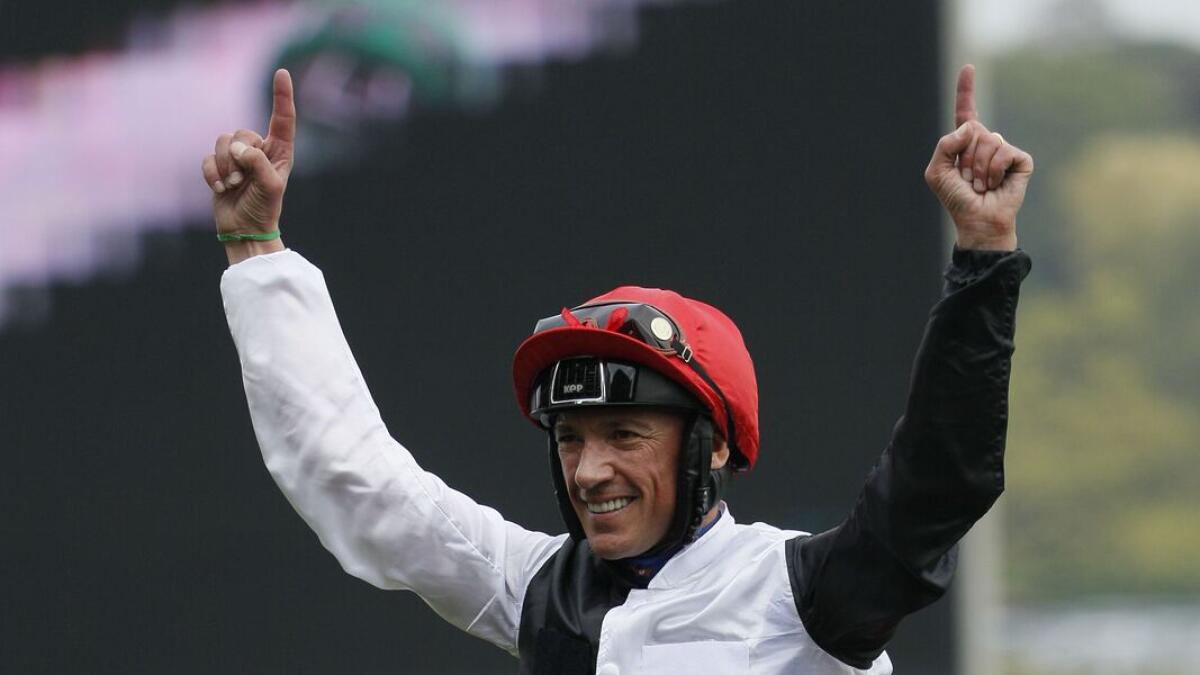 Italian jockey Lanfranco Dettori riding Golden Horn celebrates after winning the Qatar Prix de l'Arc de Triomphe horse race on  October 4, 2015 at the Longchamp racetrack in Paris.  AFP PHOTO / MATTHIEU ALEXANDRE