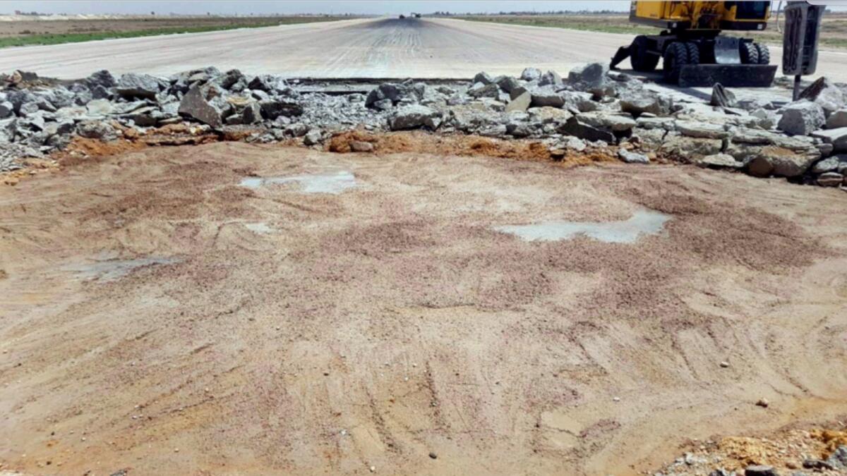 A bulldozer working on a damaged runway of the Damascus International Airport, which was hit by an Israeli airstrike, in Damascus, Syria, June 12. — AP file