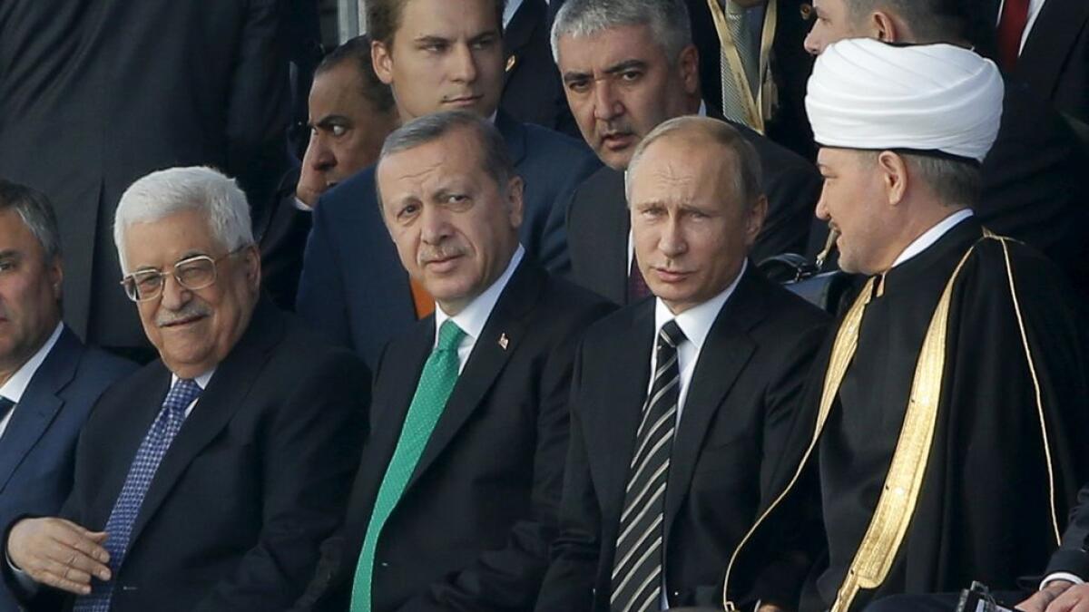 (L-R) Palestinian President Mahmoud Abbas, Turkish President Tayyip Erdogan, Russian President Vladimir Putin and Chairman of the Council of Muftis of Russia Ravil Gainutdin.