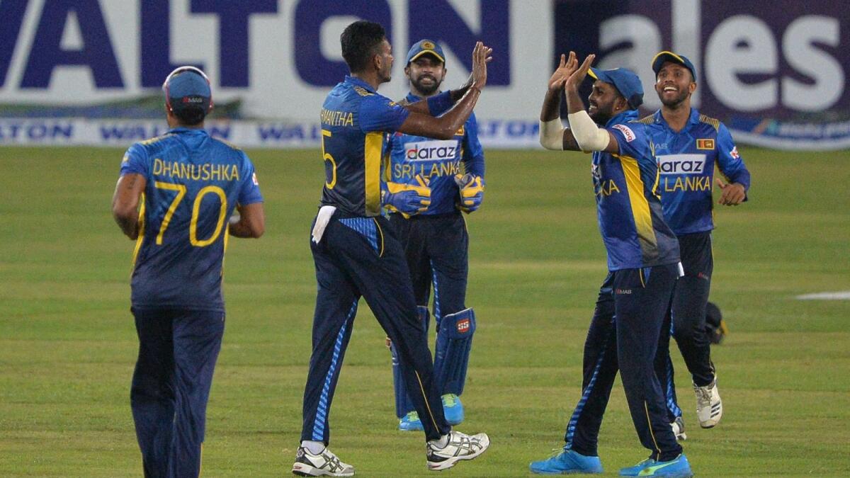 Sri Lankan players celebrate after the dismissal of Bangladesh's Taskin Ahmed (not pictured) during the third and final one-day international. — AFP