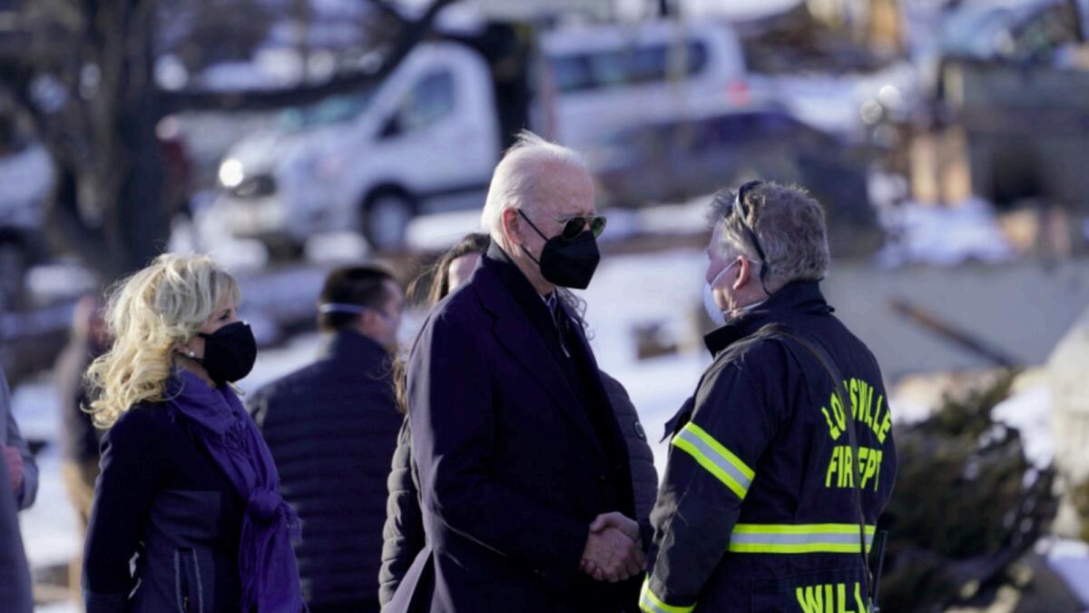 President Joe Biden and first lady Jill Biden tour a neighbourhood in Louisville, Colorado  that was impacted by the recent wildfire. — AP