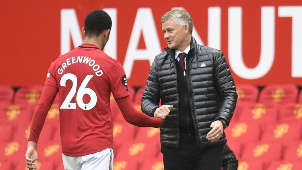 Manchester United manager Ole Gunnar Solskjaer with Mason Greenwood. (Reuters)