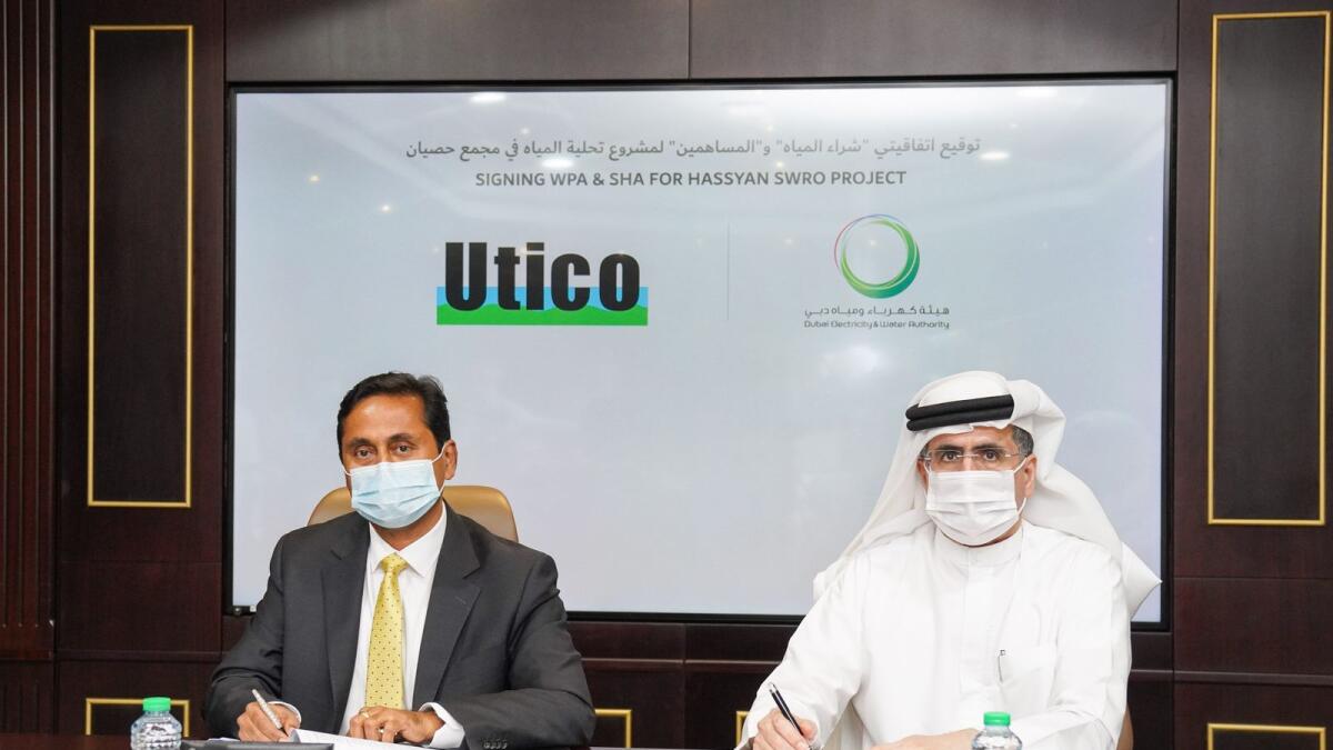 Saeed Mohammed Al Tayer, managing director and CEO of Dewa; and Ivan Richard Menezes, managing director of Utico signed the agreement in the presence of Rashed Mehran Al Blooshi, chairman of Utico, and a number of Dewa officials. — Supplied photo