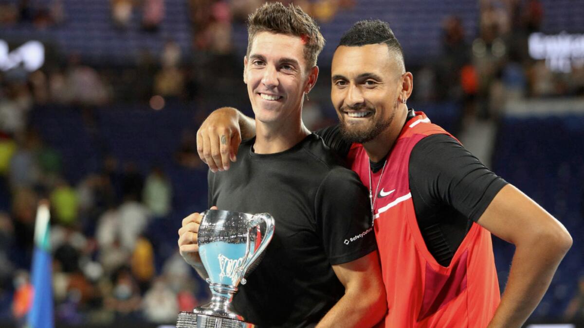 Australia's Thanasi Kokkinakis (left) and compatriot Nick Kyrgios pose with the trophy after winning the men's doubles final. (AFP)