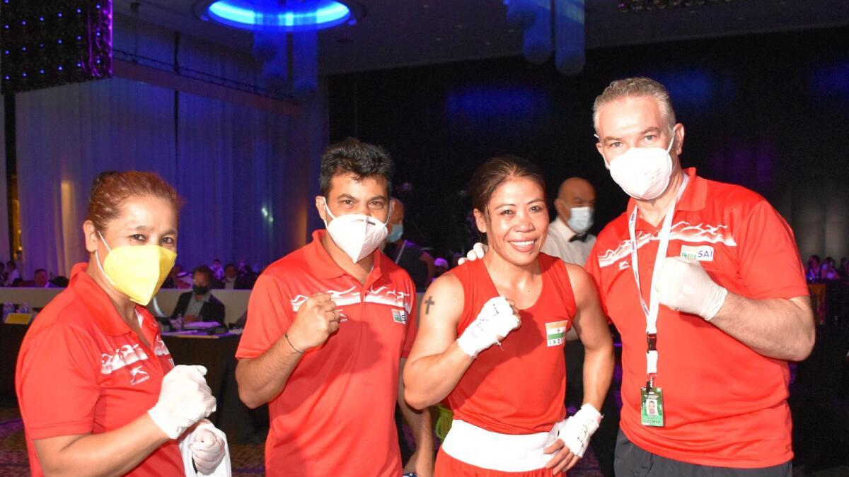 Mary Kom poses with the support staff after reaching the final. (Supplied photo)