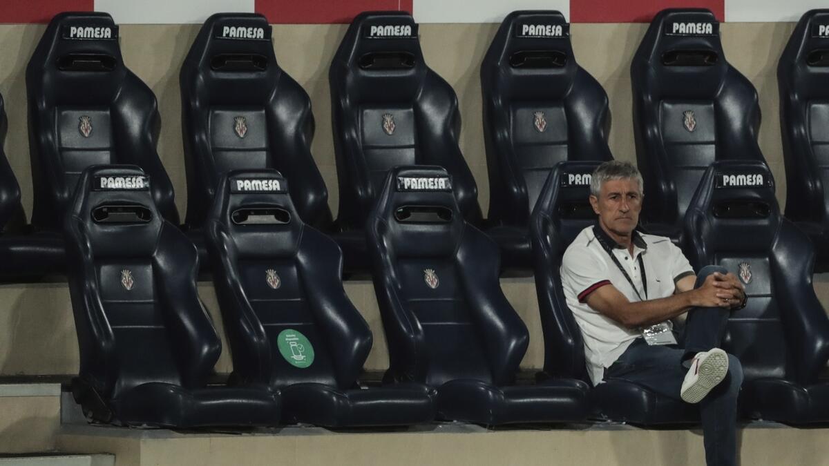 Barcelona's head coach Quique Setien sits on the bench during the Spanish La Liga match between Barcelona and Villareal