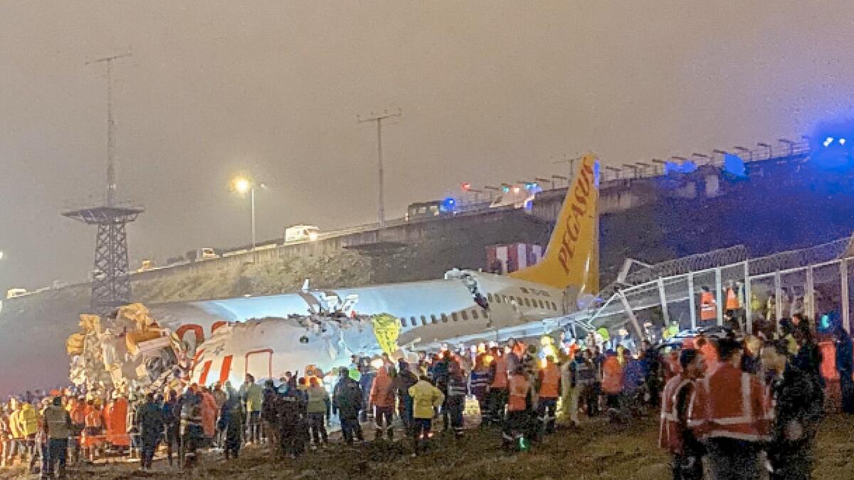 After darkness fell, television footage showed dozens of rescue workers in high-visibility jackets surrounding the plane with flashlights.?
