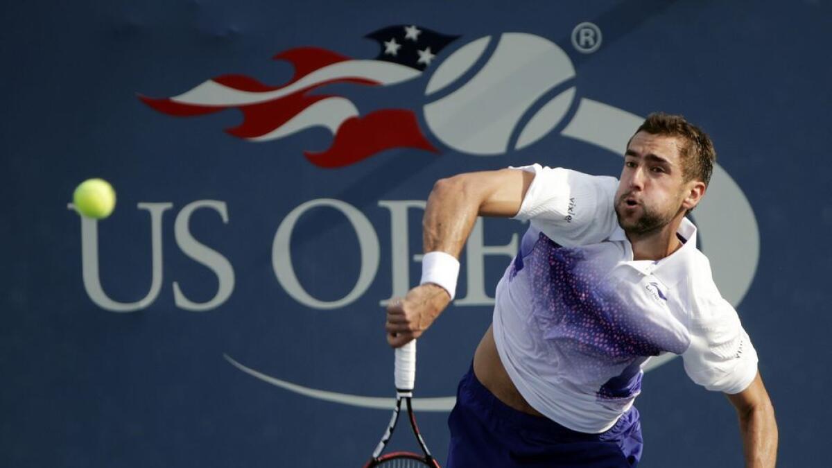Marin Cilic, of Croatia, serves to Guido Pella, of Argentina, during the first round of the US Open tennis tournament, Monday, Aug. 31, 2015, in New York. 