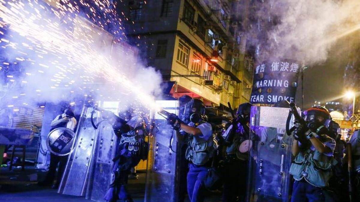 Police fire tear gas at anti-extradition bill protesters during clashes in Sham Shui Po in Hong Kong. - Reuters