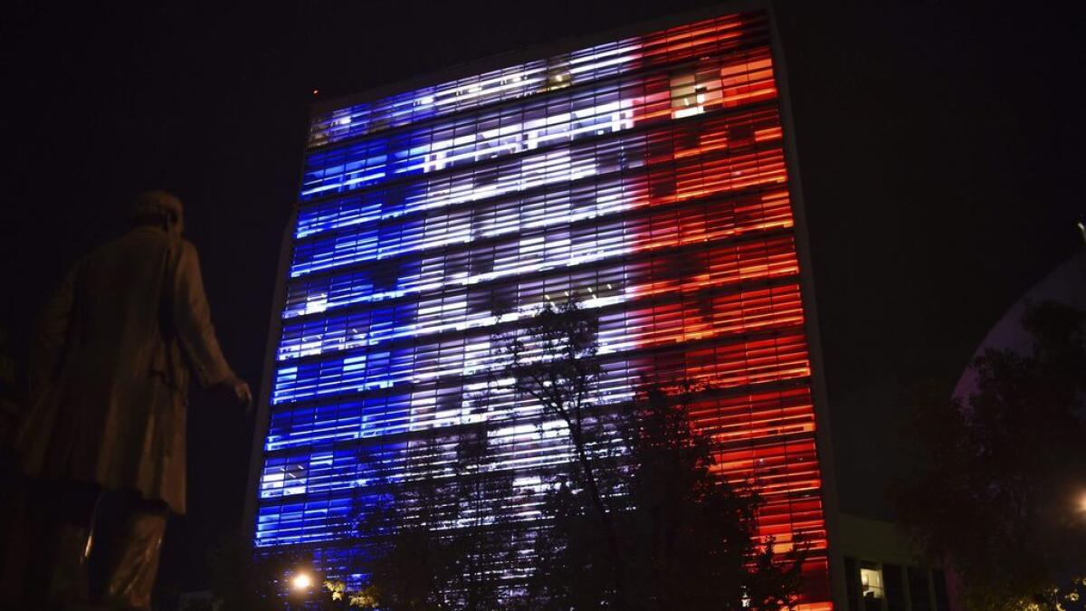 Mexican Senate building is illuminated with the colors of the French national flag