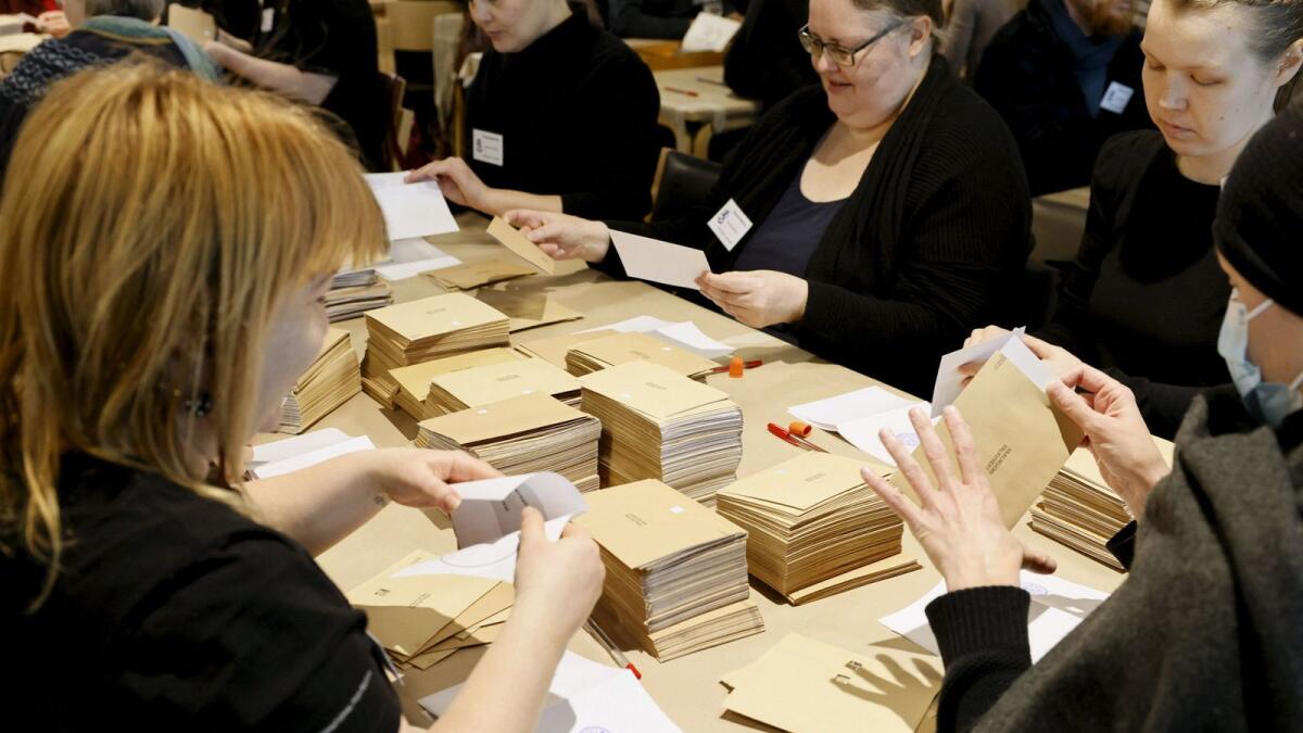 Officials start counting the advance votes of the Finnish parliamentary elections at the Kallio administrative building in Helsinki on Sunday.  — AFP