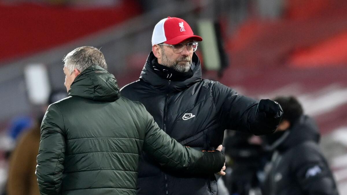 Liverpool's manager Jurgen Klopp (right) and Manchester United's manager Ole Gunnar Solskjaer greet each other at the end of the match. — AP