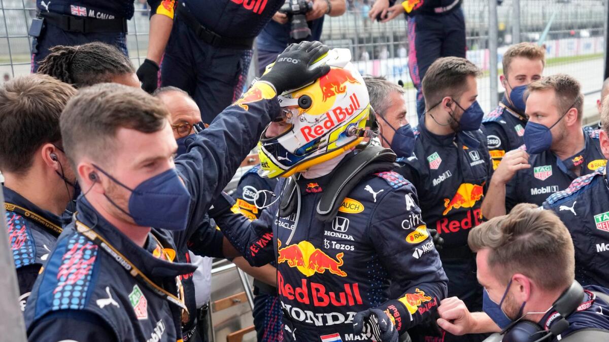 Red Bull driver Max Verstappen of the Netherlands celebrates with teammates after winning the Styrian Formula One Grand Prix. — AP