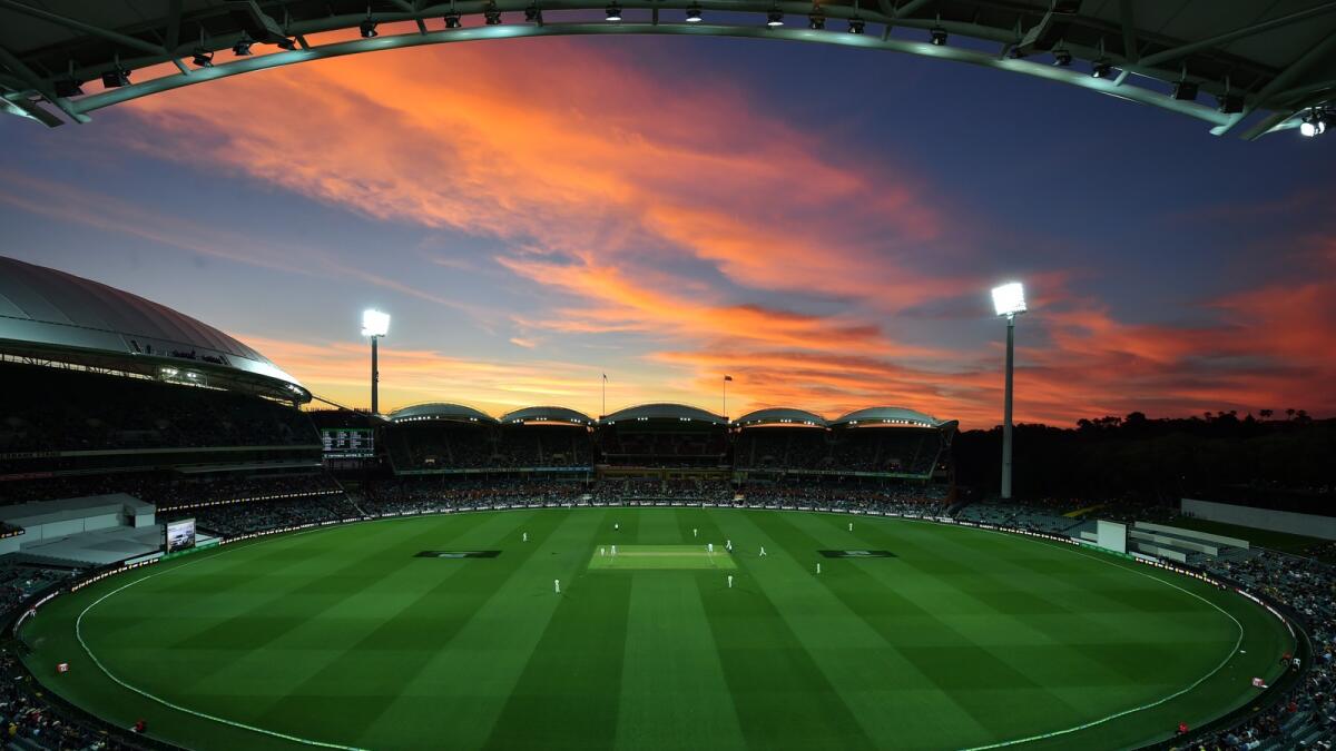 The sun sets during the first innings of the day-night third Test cricket match between Australia and South Africa at the Adelaide Oval. — AFP file