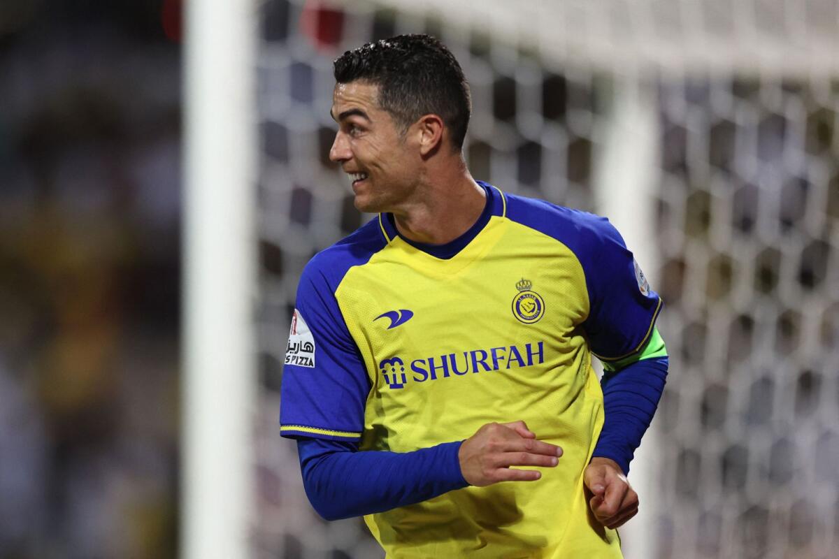 Al Nassr's Portuguese forward Cristiano Ronaldo celebrates scoring his team's second goal against Al Wehda at the King Abdulaziz Stadium in Mecca on Thursday. -- AFP
